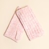 Light pink ribbed knitted fingerless gloves laid flat against a neutral backdrop