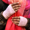 pink gloves with vibrant scarf on model