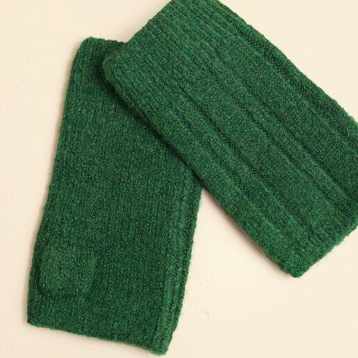 Close-up of forest green knitted fingerless gloves showing ribbing texture