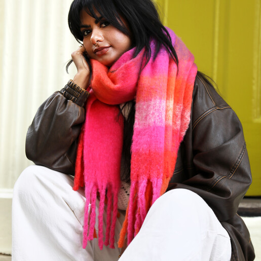 pink scarf and brown leather jacket with scarf on model