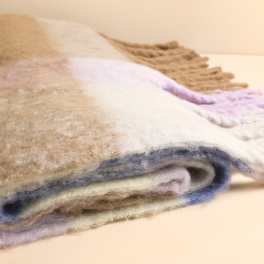 Close-up detail of folded soft brushed lilac and yellow check scarf