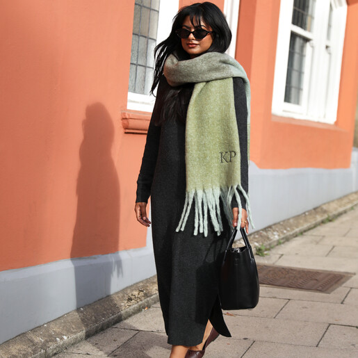 model shot of black outfit and green scarf