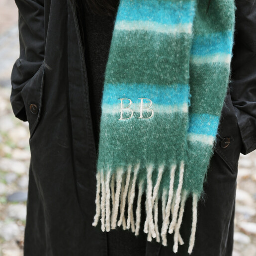 close up of initial personalisation on scarf