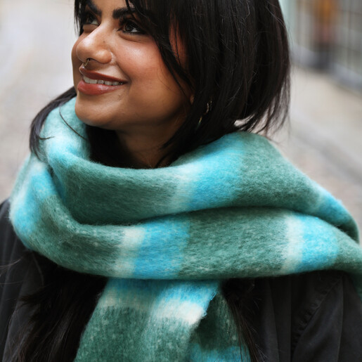 model shot of bright blue winter scarf