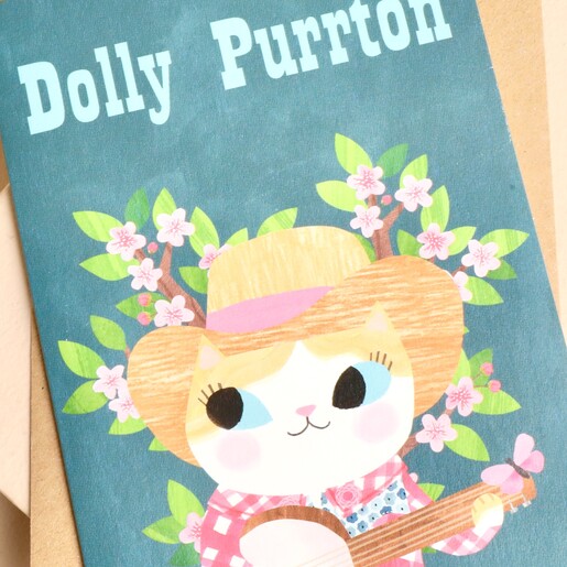Close-up of illustrated cat in cowboy hat strumming banjo on Dolly Purrton card