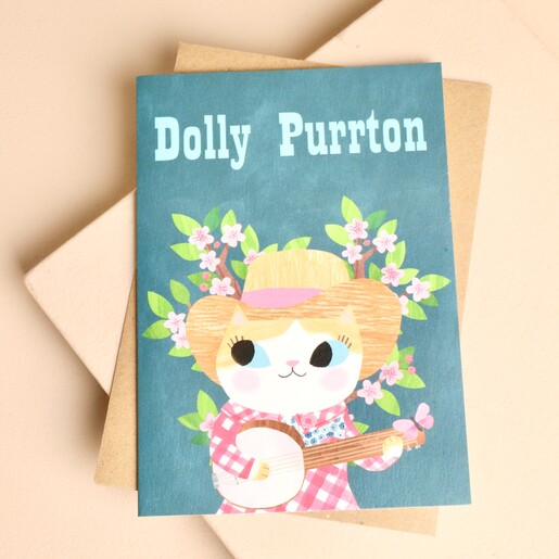 Ohh Deer Dolly Purrton greeting card with illustrated banjo-playing cat on teal background