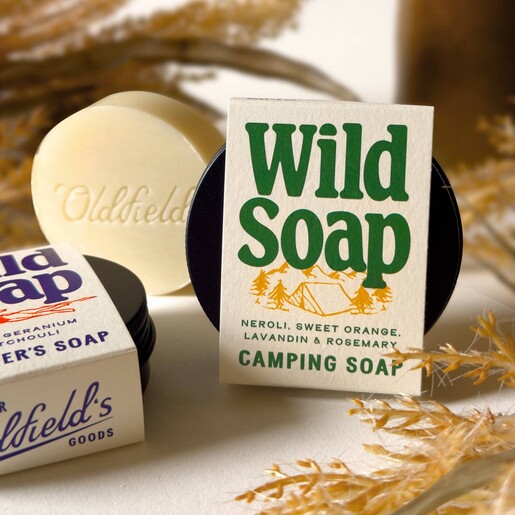 Oldfield neroli and rosemary solid camping soap bar next to packaging