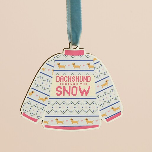 Close-up of wooden Christmas jumper decoration reading Dachshund Through The Snow.