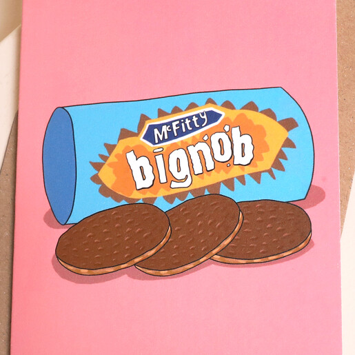Close-up of humorous bignob biscuit illustration against a vibrant pink background