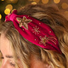 close up of pink headband on blonde hair