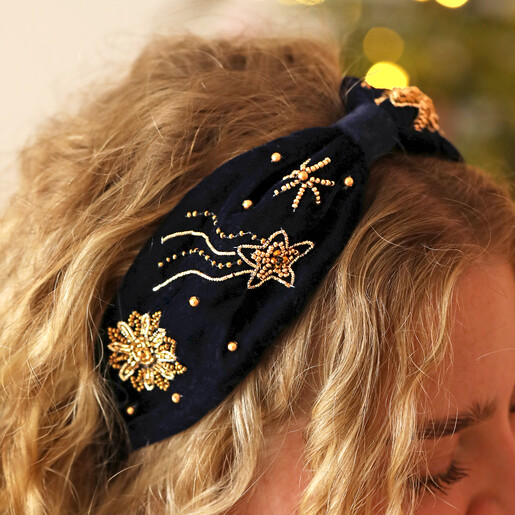 close up of celestial headband in navy on model