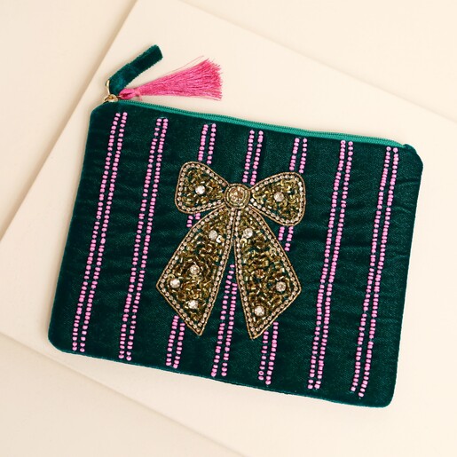 Forest green velvet pouch with pink beaded stripes and a central gold beaded bow