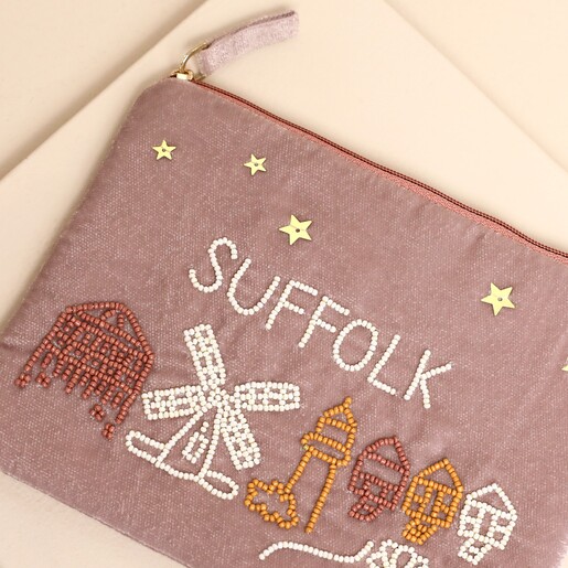 Close-up of beaded Suffolk lettering and seaside details on pink velvet