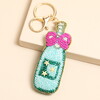 blue bottle and pink bow accessory