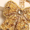 close up of varying beads on gold accessory