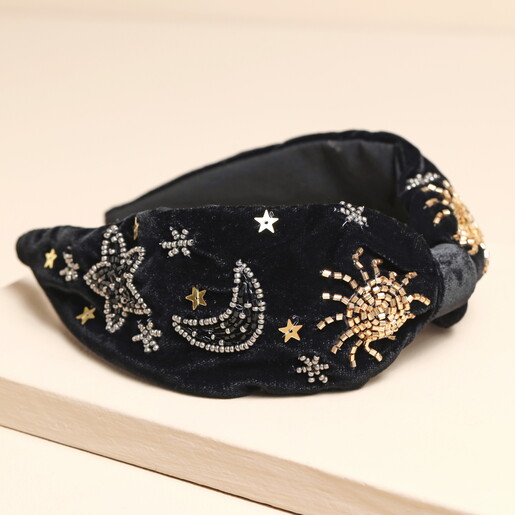 Side view of black velvet celestial headband showing bead and sequin details