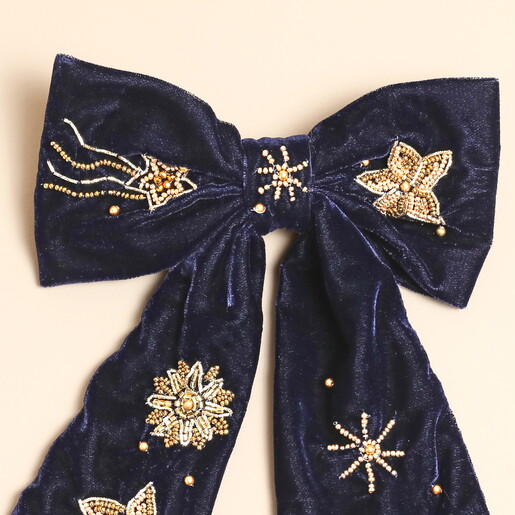 Close Up of Beaded Stars on Soft Velvet Bow
