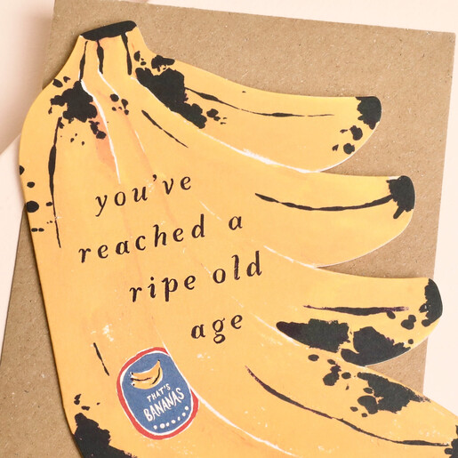 Close-up of quirky banana bunch birthday card with ripe old age caption