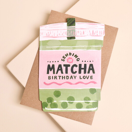 Die-cut iced matcha latte birthday card on a brown kraft envelope.