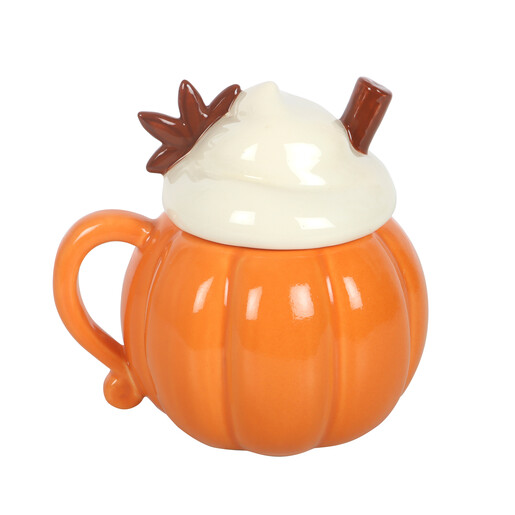 Front view of glazed orange pumpkin mug with cream swirl lid on plain background
