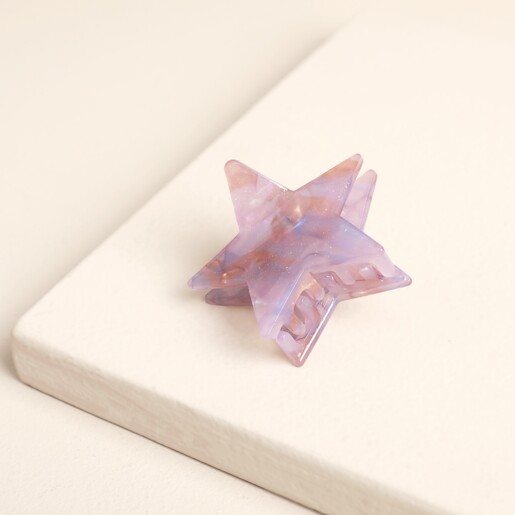 Angled view showing the sprung teeth of the lilac star hair clip