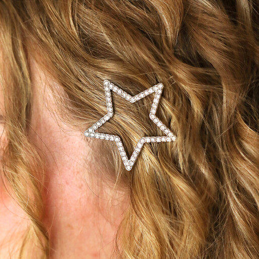 Close-up of the crystal encrusted silver star hair clip styled in blonde wavy hair