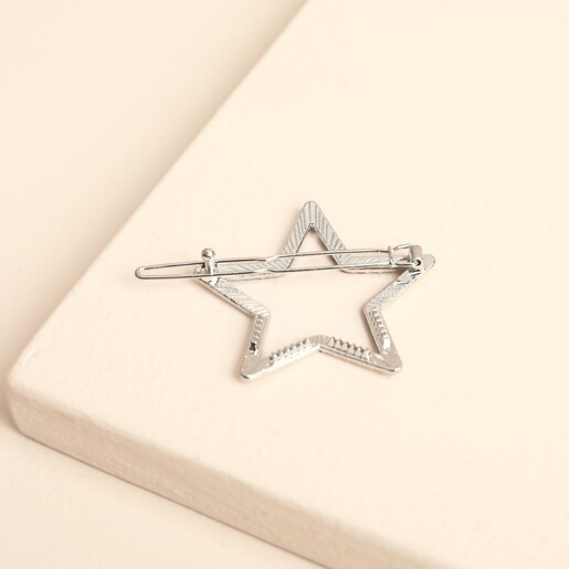 Back of the silver crystal star hair clip showing the metal slide grip fastening