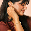 model shot of pearl charm bracelet in gold