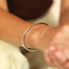 waterproof bangle in silver on model