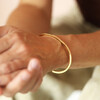 model shot of gold bangle