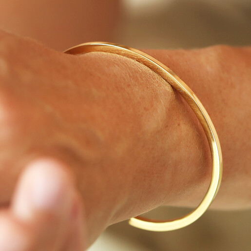 model shot of waterproof cuff bangle in gold