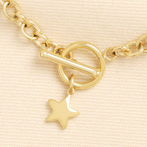 Close-up of the gold toggle clasp and polished star charm detail