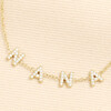 Close up of crystal encrusted Nana letter charms on gold chain
