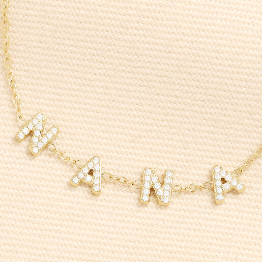 Close up of crystal encrusted Nana letter charms on gold chain