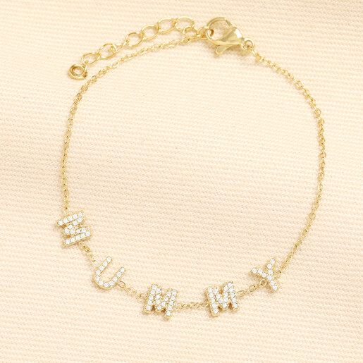 Gold stainless steel bracelet featuring crystal MUMMY letter charms on a delicate trace chain