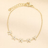 Gold stainless steel trace chain bracelet with crystal letters spelling Nanny