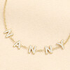 Close up of crystal encrusted letters spelling Nanny on gold bracelet