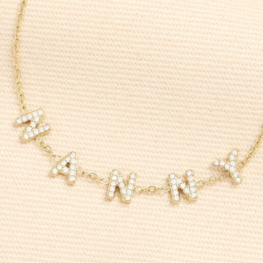 Close up of crystal encrusted letters spelling Nanny on gold bracelet