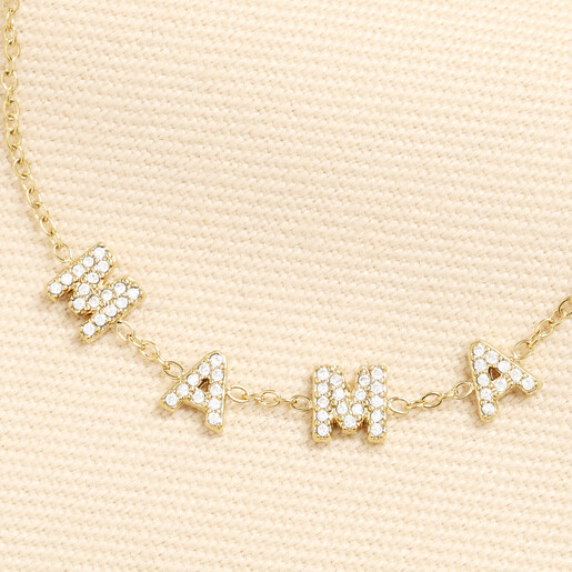 Close up of gold stainless steel bracelet showing crystal M A M A letter charms.