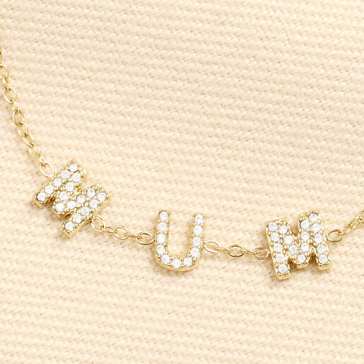 Close-up of crystal encrusted MUM charms on gold chain bracelet