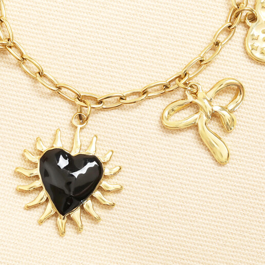 close up of black enamel heart charm
