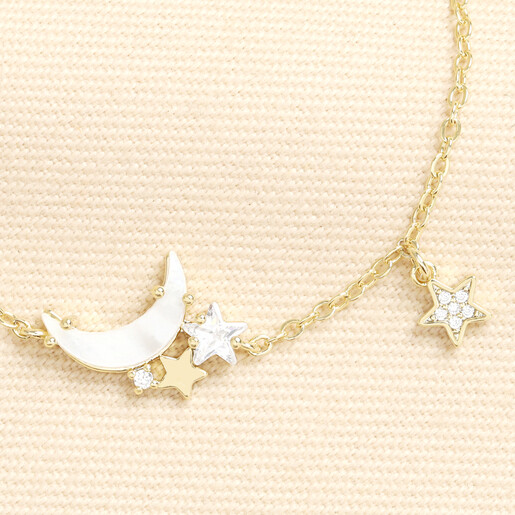 Close-up of the shell crescent moon and sparkling cubic zirconia star charms