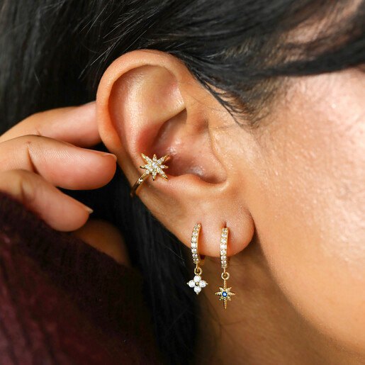 layered model shot of crystal huggie hoops 
