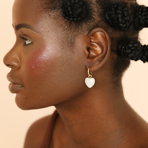 semi-precious hoop earrings with white heart charm on model