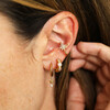 layered model shot of huggie hoop earrings