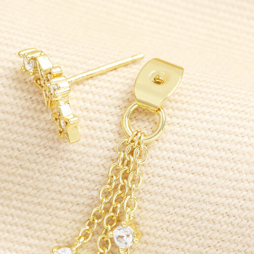 Angled view showing the earring post and tiered chain drop attachment