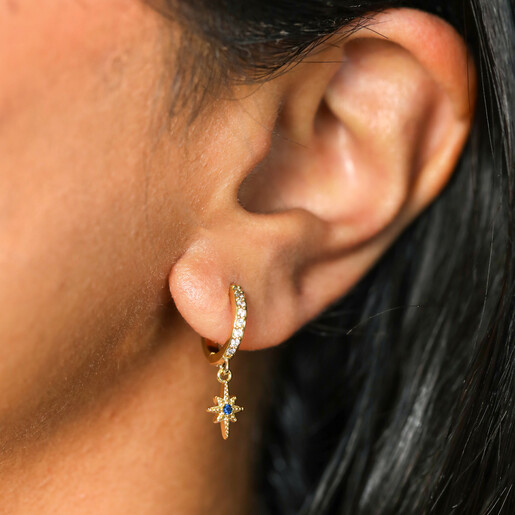 model shot of crystal huggie hoop earrings in gold