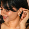 model shot of drop earrings in gold
