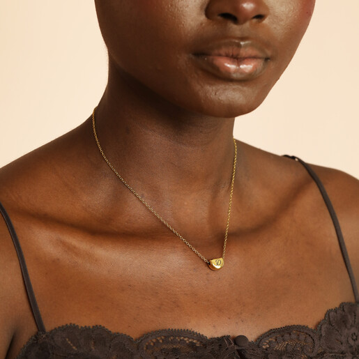 sentimental pendant necklace in gold on model