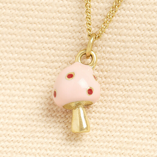 close up of enamel mushroom pendant